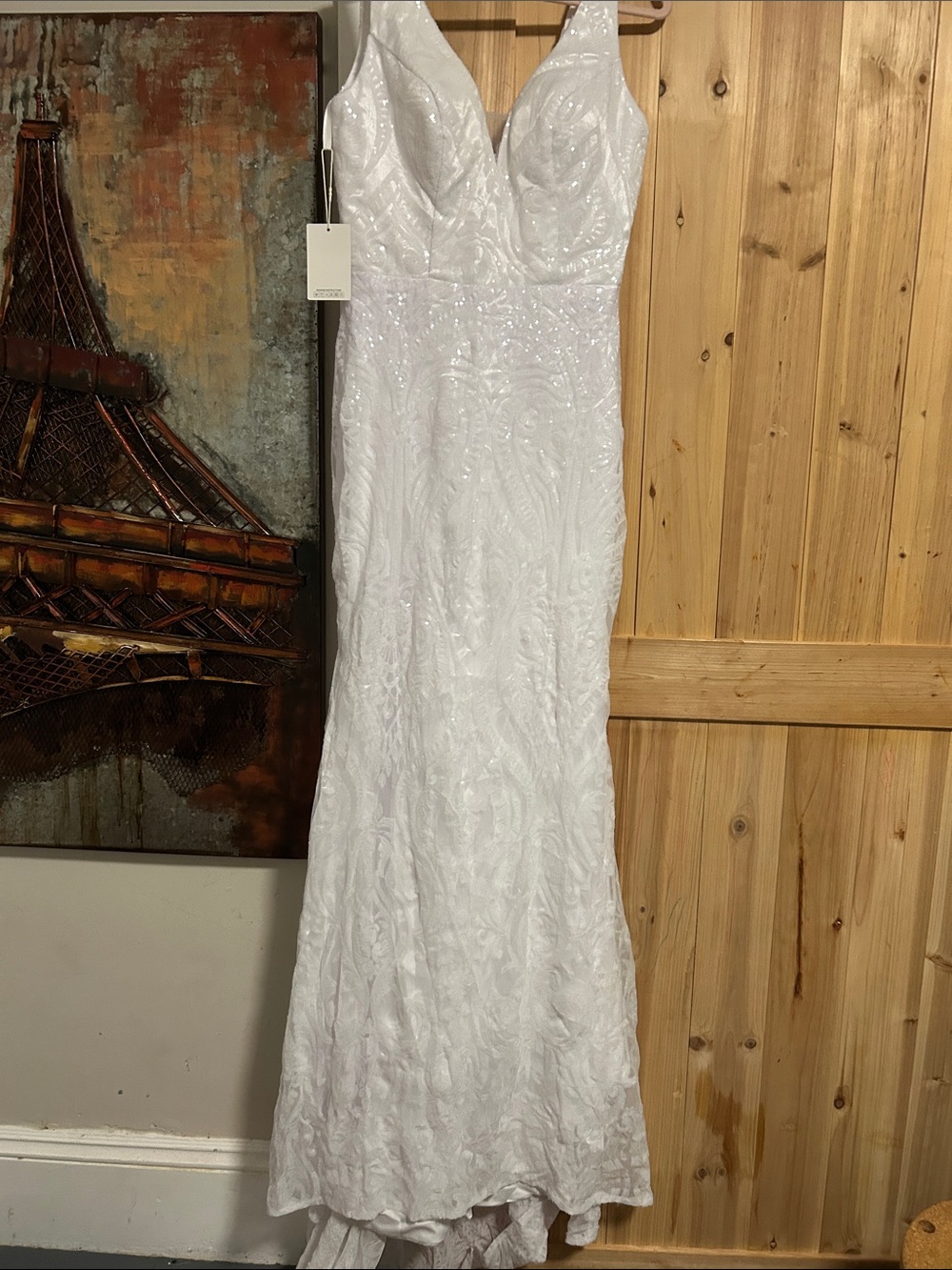 Wedding Gown with sequin embroidered detail train and zip back .